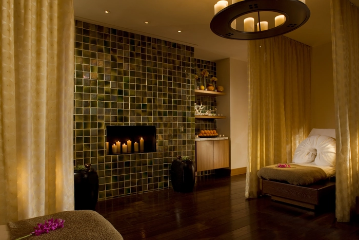 Interior of a Chicago hotel spa. Custom drapery separates the beds.