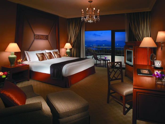 Primary bedroom in an upscale hotel. Drapery designed and built by Skyco.