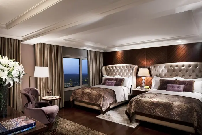 Double bedroom at the Palace Hotel. Privacy drapes custom-built by Skyco.
