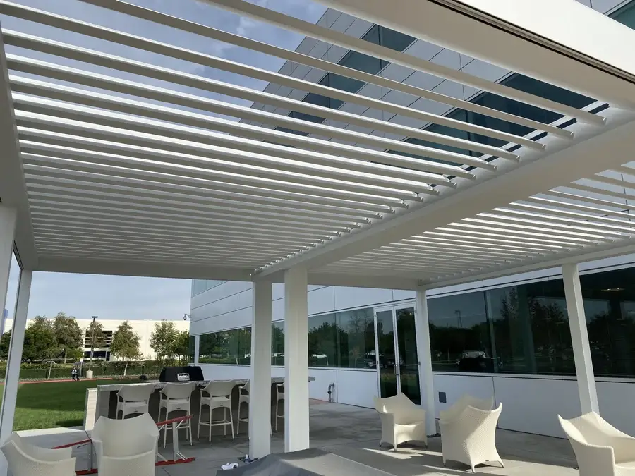 Shutters on the top of a custom shading structure, designed by Skyco.