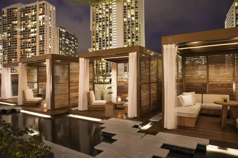 Three cabanas at a Hawaii resort with wooden shutters built by Skyco.