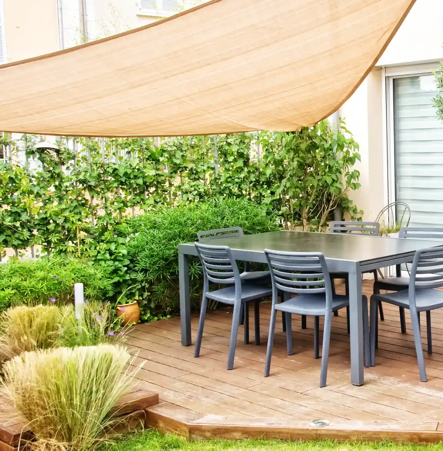 Twister Sail installed over a set of outdoor patio furniture.
