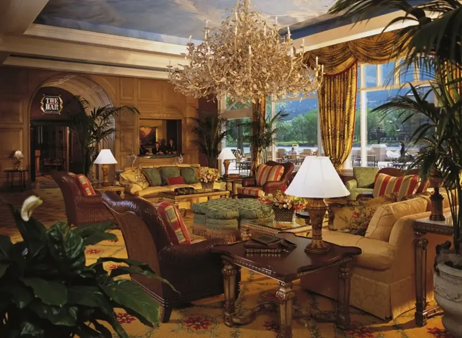 Intricately decorated hotel mezzanine with golden drapery.