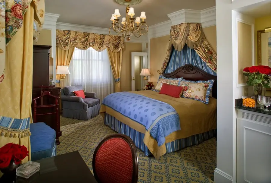 Elaborately decorated hotel suite with intricate drapery custom-designed by Skyco.