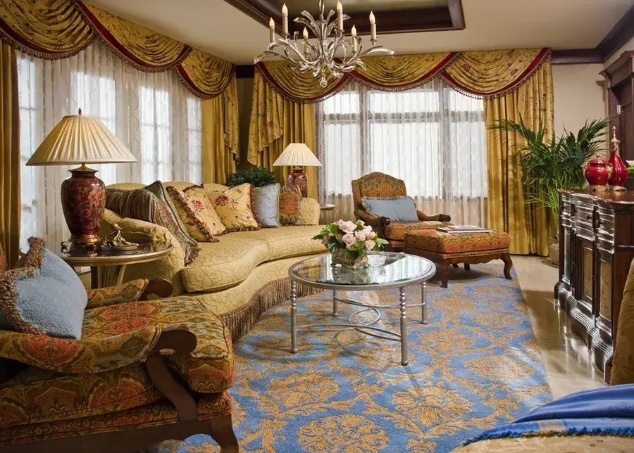 Custom drapes made of golden fabric, designed and built by an expert shading company.