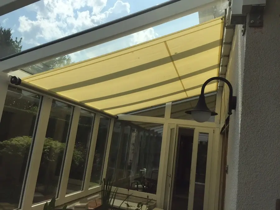Angled patio shade, custom designed and built by Skyco.